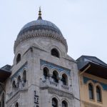 Travel Itinerary - a tall building with a dome on top of it