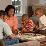 Female Safety - family playing board games