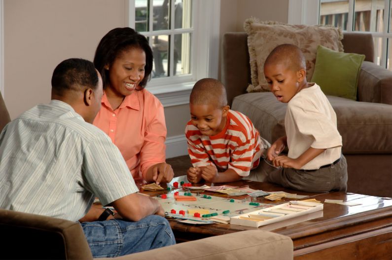 Female Safety - family playing board games