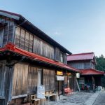 Rural Japan - an old wooden building with a red roof