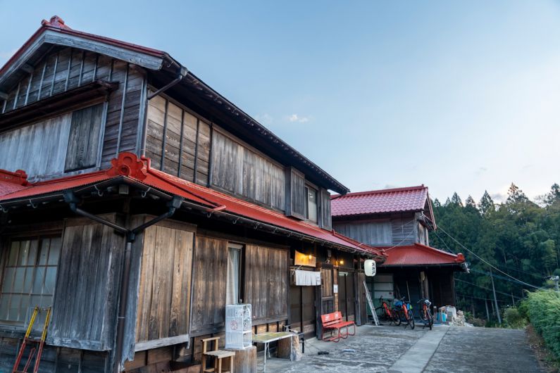 Rural Japan - an old wooden building with a red roof