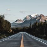 Canadian Rockies - wide road under blue sky