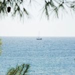 Greece Islands - a boat is out in the open water