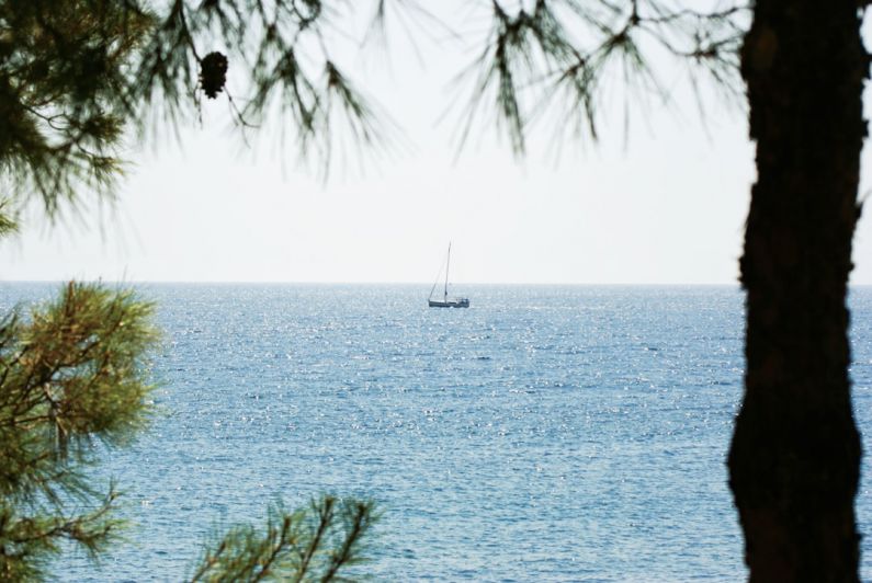 Greece Islands - a boat is out in the open water