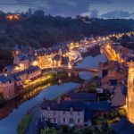 Europe Medieval - aerial photography of lighted concrete buildings at night time