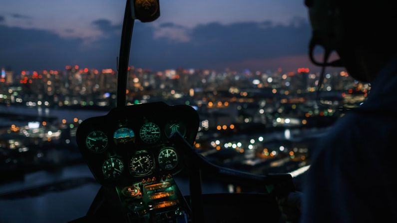 Tokyo Cityscape - a person driving a car