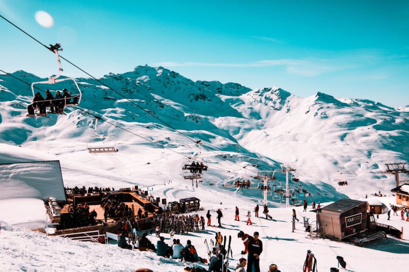 Ski Resort - crowd gathered on snowy mountain park