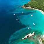 Secluded Beach - a group of boats on a beach