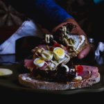 Culinary Budget - person holding piece of cake