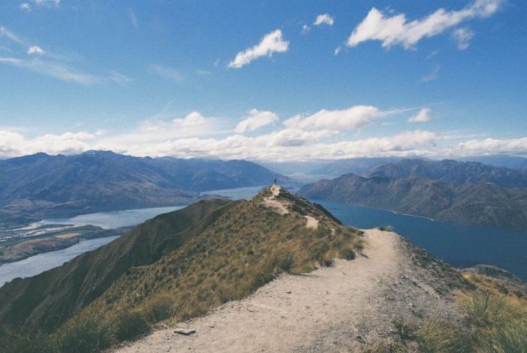 New Zealand Budget - photography of mountain near body of water
