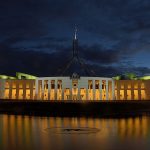 Luxury Budget - white concrete building near body of water