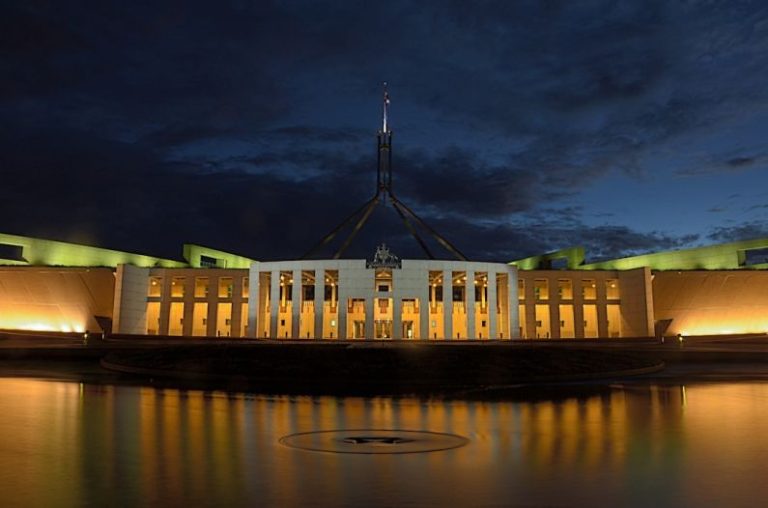 Luxury Budget - white concrete building near body of water