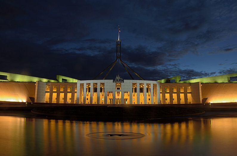 Luxury Budget - white concrete building near body of water