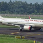 Airline Rewards - white and red passenger plane on airport during daytime